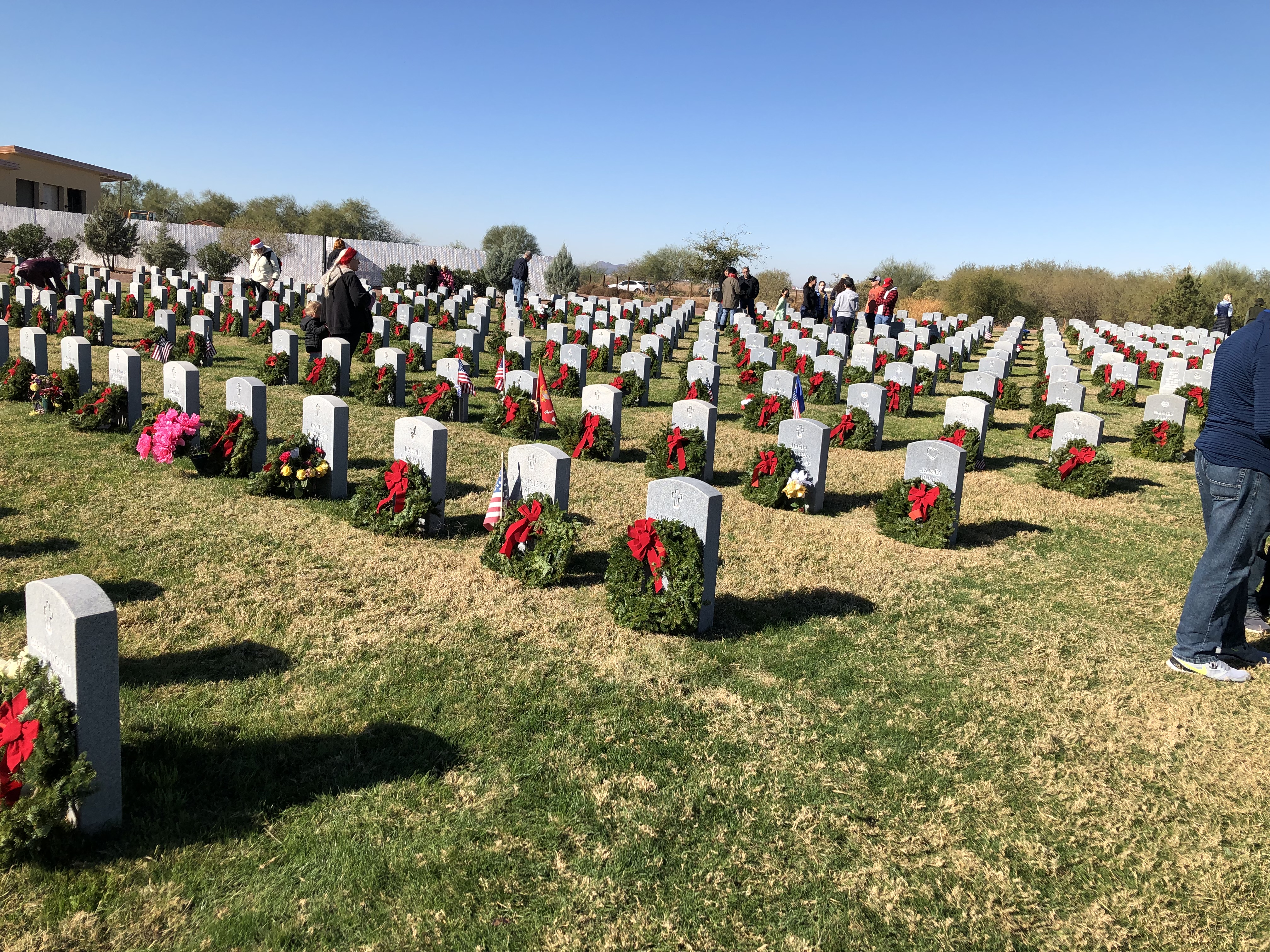 headstones with Christmas wreaths