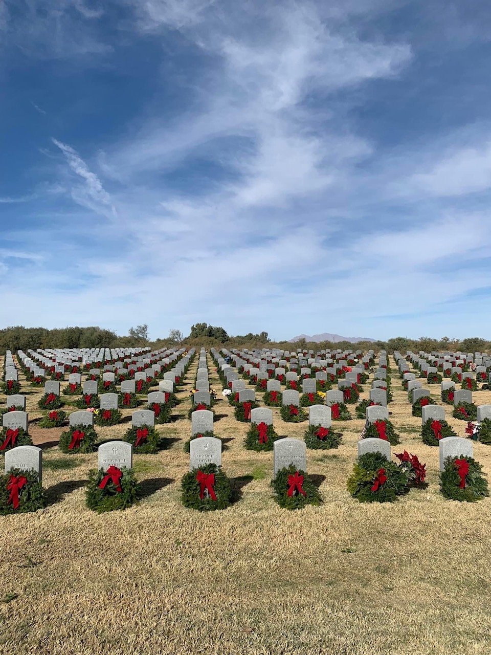 headstones with Christmas wreaths