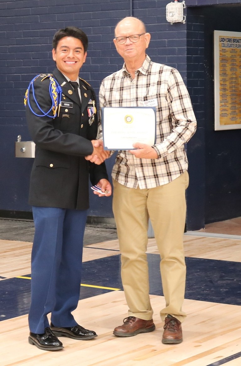 Jerry Peterson presenting a MOAA award to Cadet Jonathan Ostos