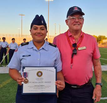Tom Eiff shown with Desert View High School JROTC award winnerr